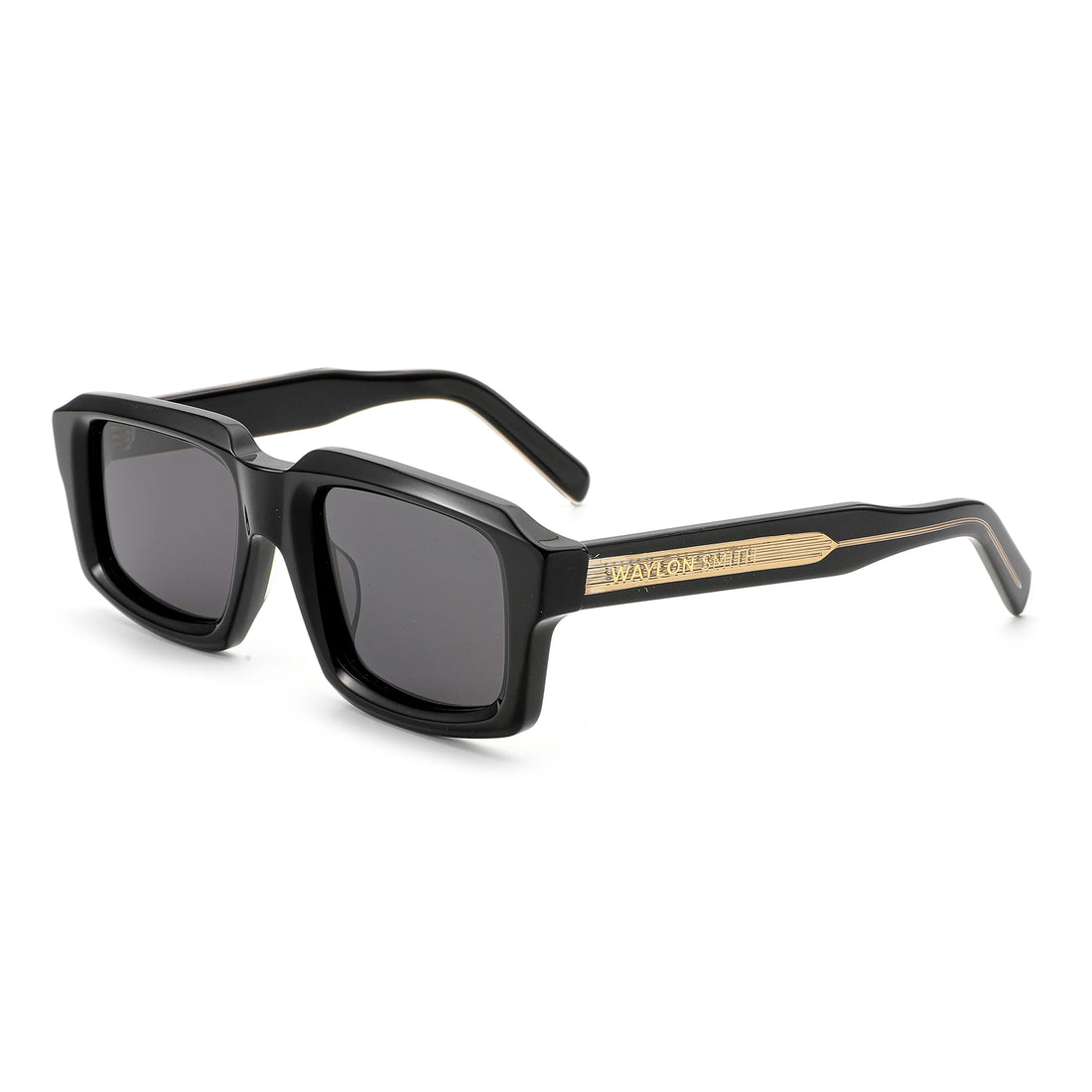 Three-quarter angle view of black Waylon Smith sunglasses on a white background, showing the Waylon Smith wordmark on the gold temple detail