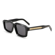 Three-quarter angle view of black Waylon Smith sunglasses on a white background, showing the Waylon Smith wordmark on the gold temple detail