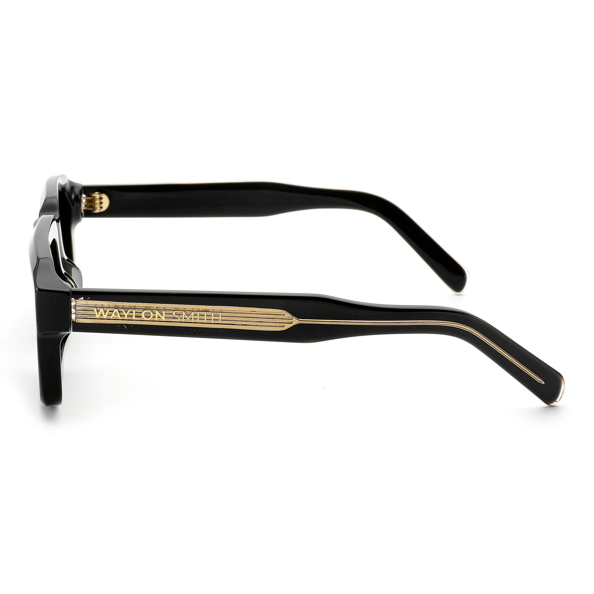 Side view close-up of black Waylon Smith sunglasses on a white background, showing the Waylon Smith wordmark on the gold temple detail