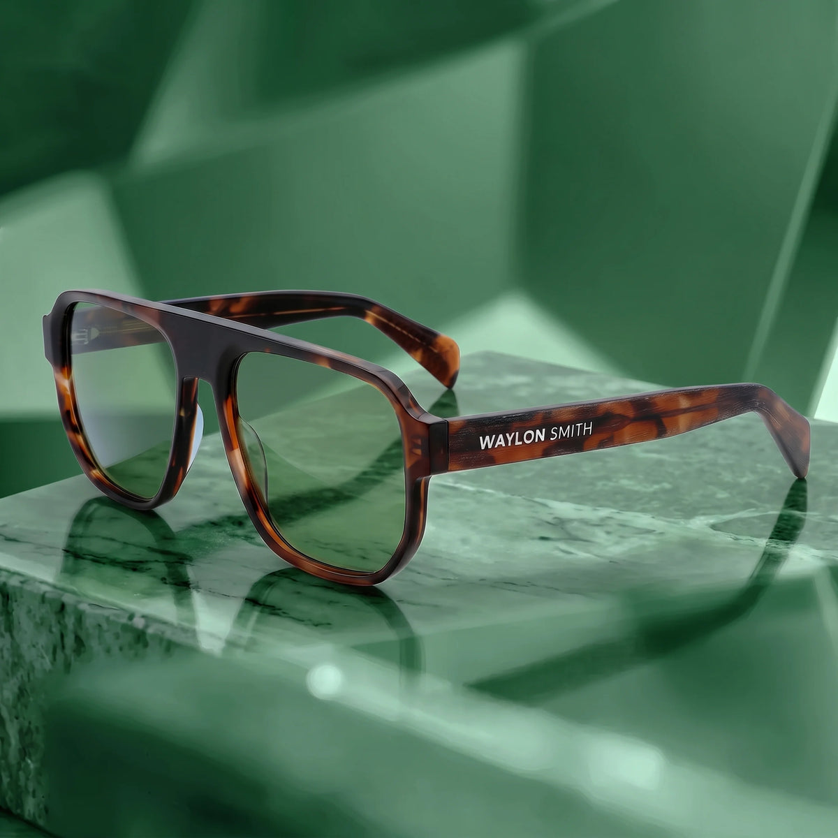 Waylon Smith sunglasses in tortoiseshell, studio product shot on a green marble surface, showing the Waylon Smith wordmark on the temple
