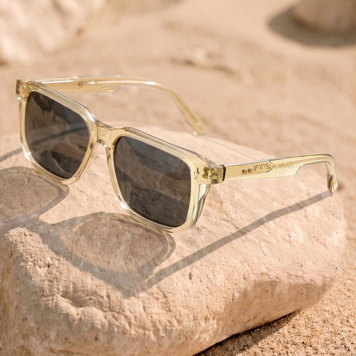 Waylon Smith The Vinewood sunglasses in Champagne Gold, lifestyle shot resting on a sunlit rock