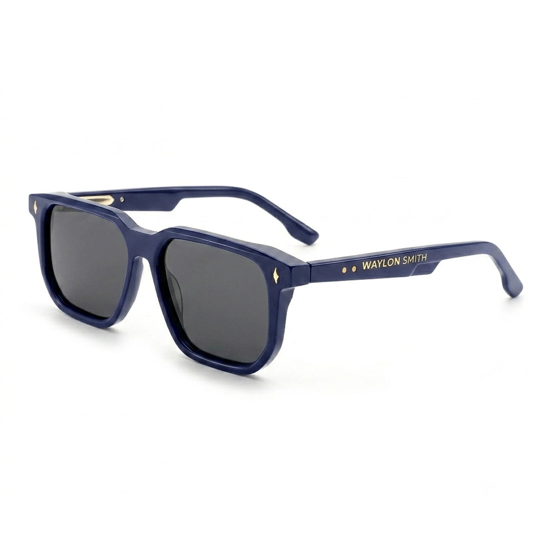 Three-quarter angle view of Waylon Smith Vinewood sunglasses in blue with gold accents on a white background