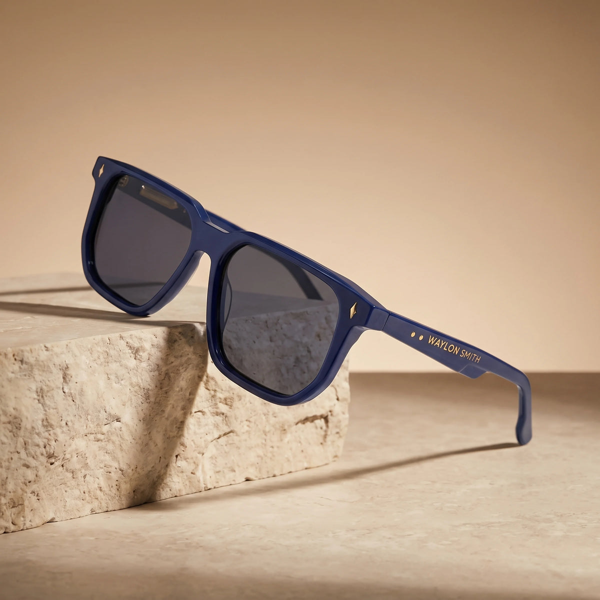 Waylon Smith Vinewood sunglasses in blue, studio product shot on a stone pedestal